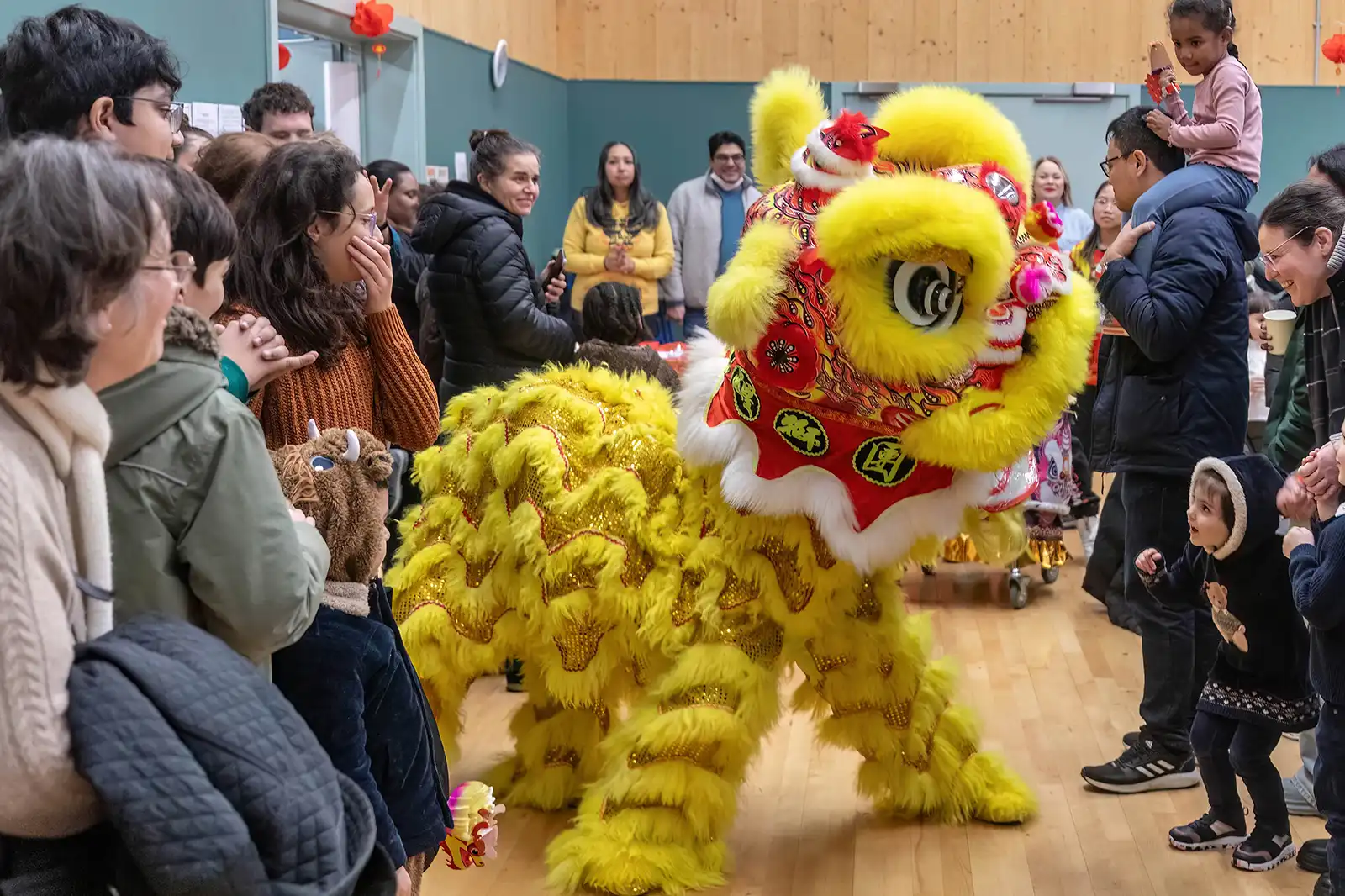 People watching the lion dance as part of Lunar New Year